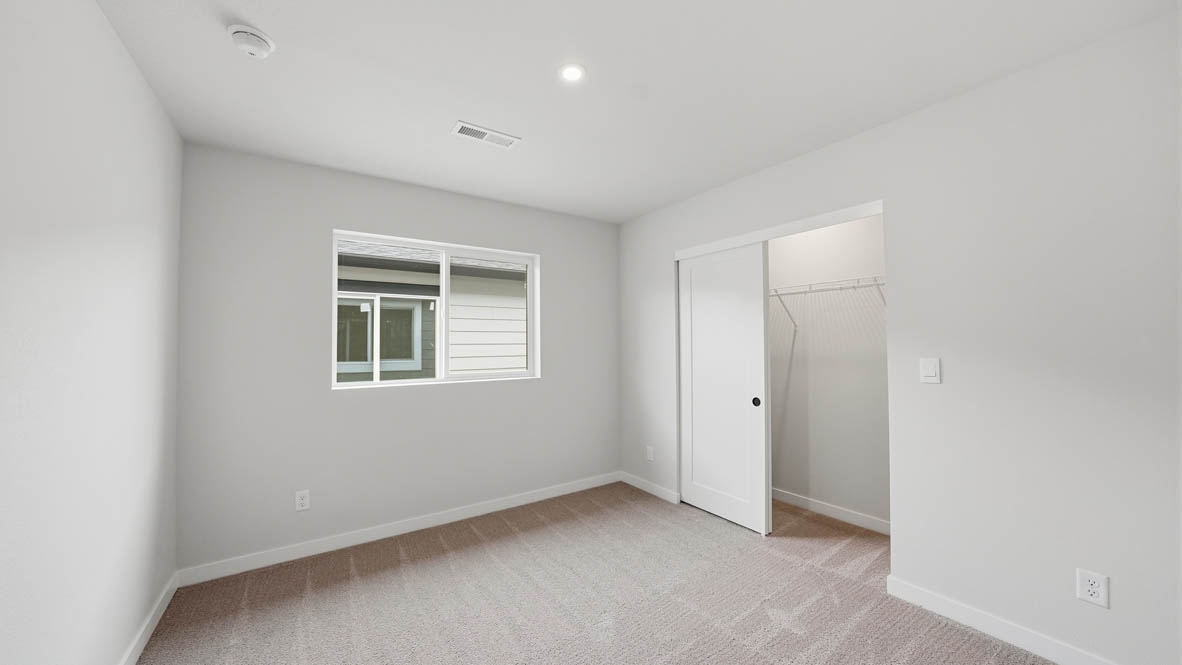 Stevens Ranch bedroom with carpet, window, white walls, and closet