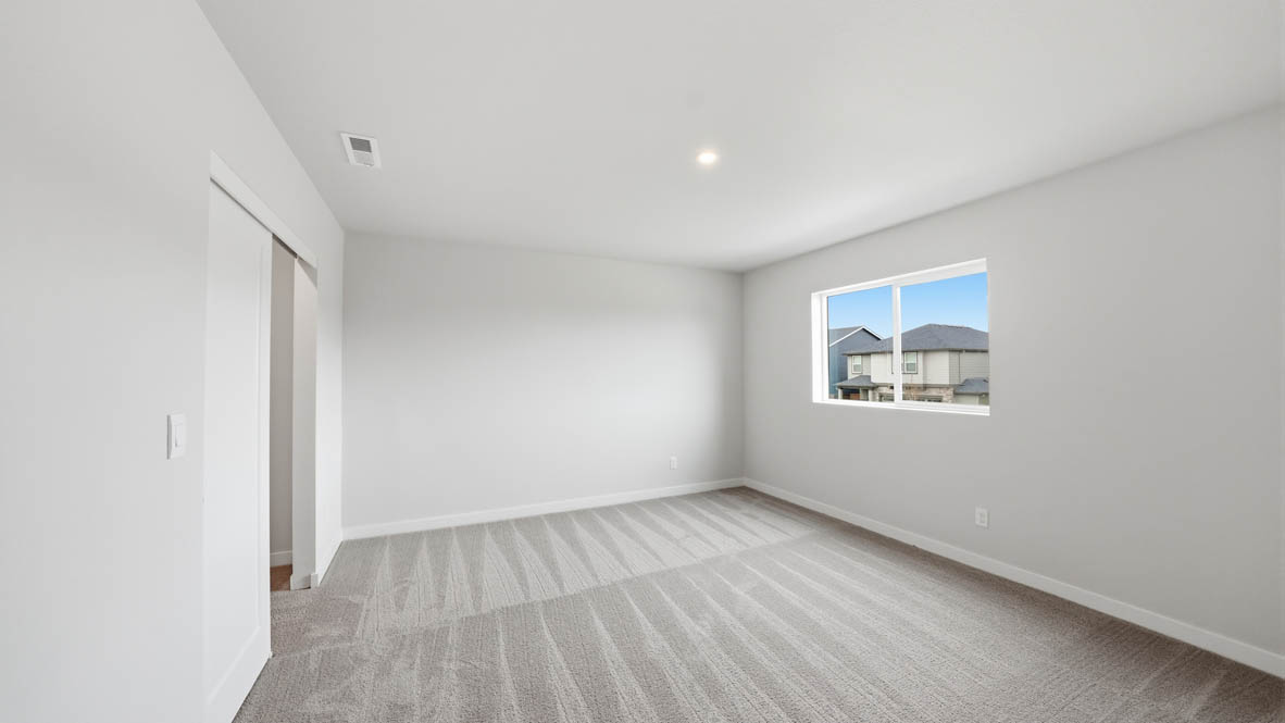Stevens Ranch bedroom with carpet, window, and white walls