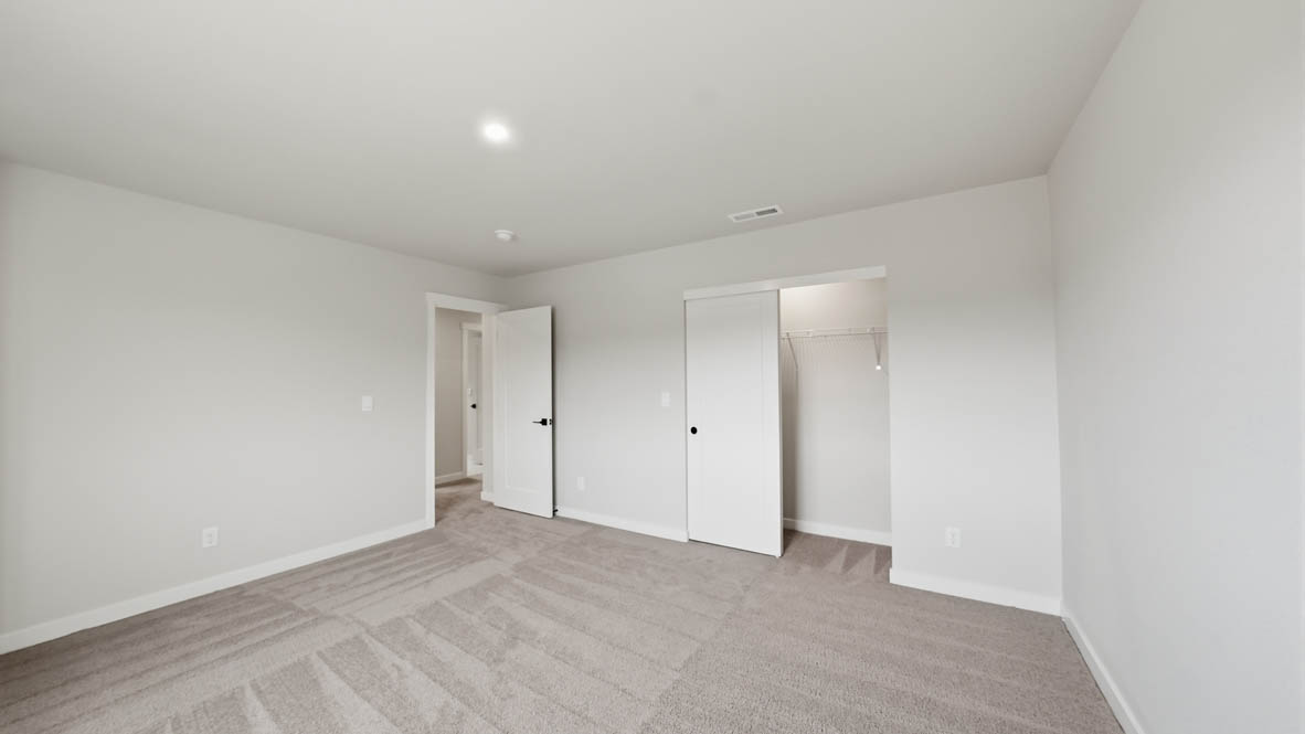 Stevens Ranch bedroom with carpet, window, closet, and white walls