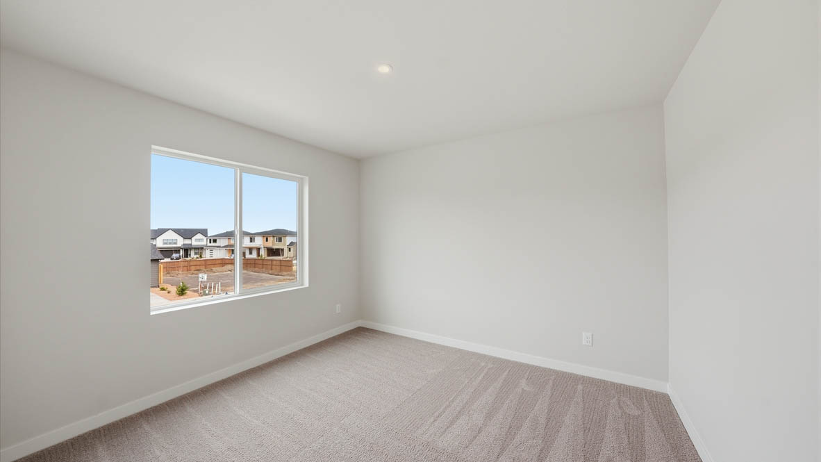 Stevens Ranch bedroom with carpet, window, and white walls