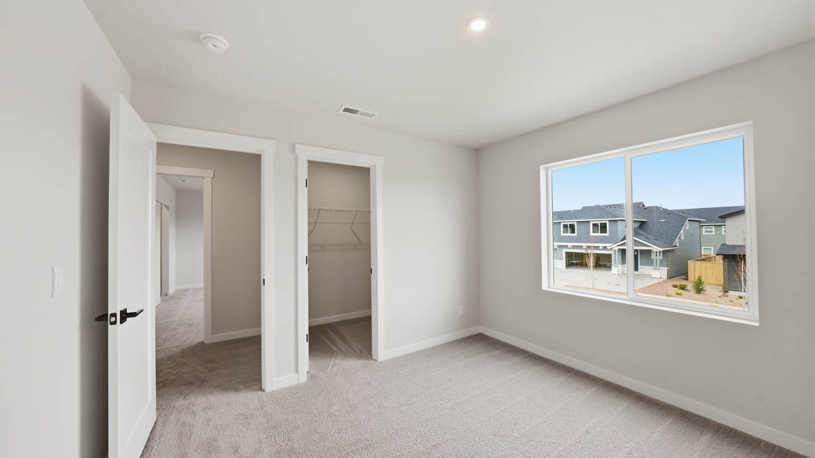Stevens Ranch bedroom with carpet, window, closet, and white walls
