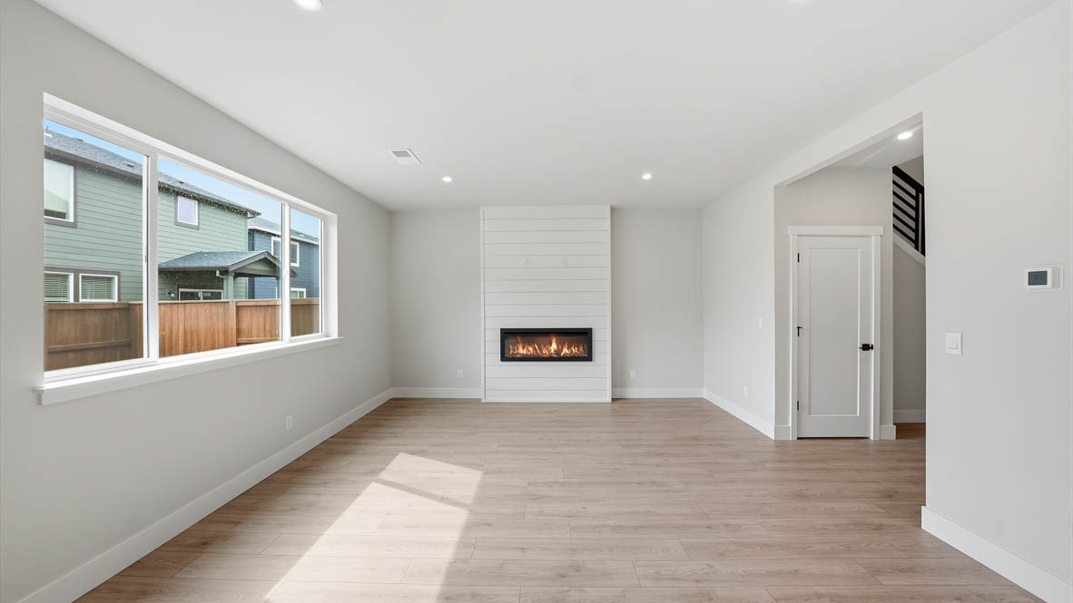 Stevens Ranch Great room with white walls, windows