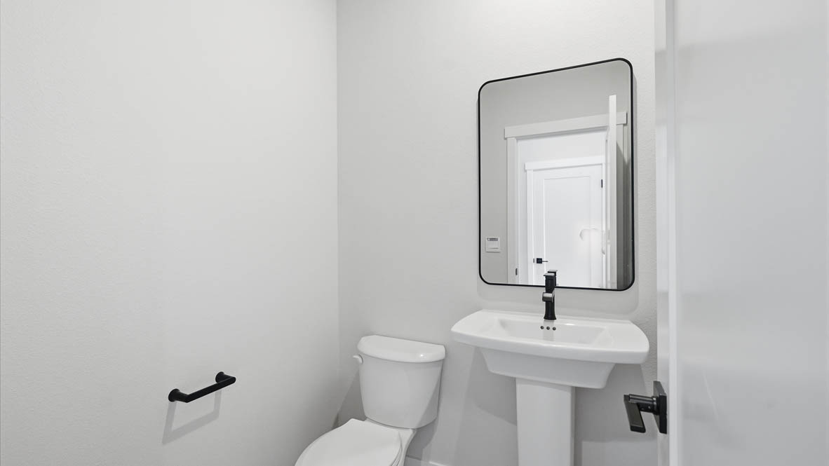 Stevens Ranch Powder Room with single sink vanity, mirror, white walls, and toilet