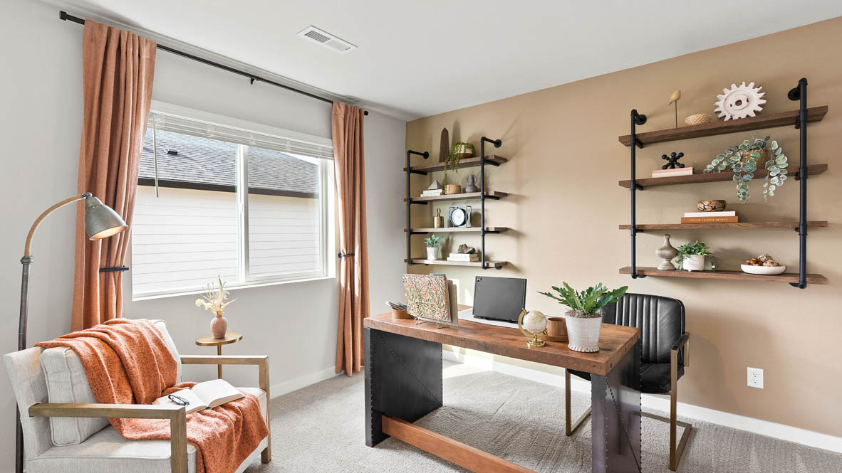 Stevens Ranch Diamond 3816 bedroom mock office with a desk, hung up shelves, a couch, chair, and carpet