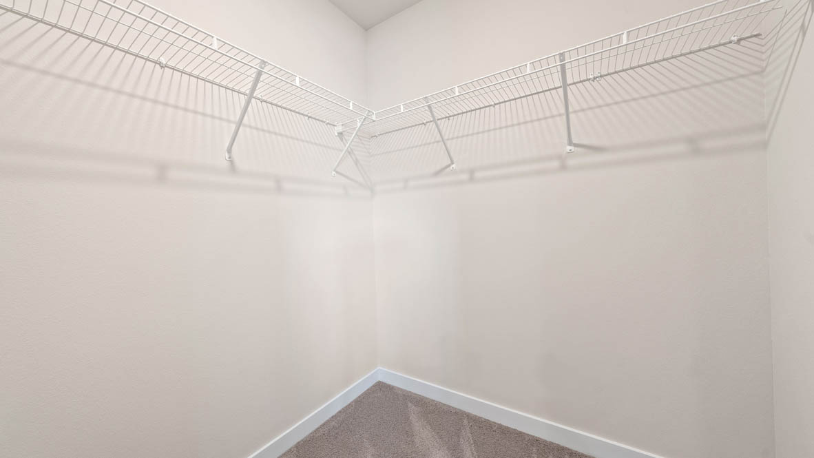 Stevens Ranch walk in closet with white wire shelving