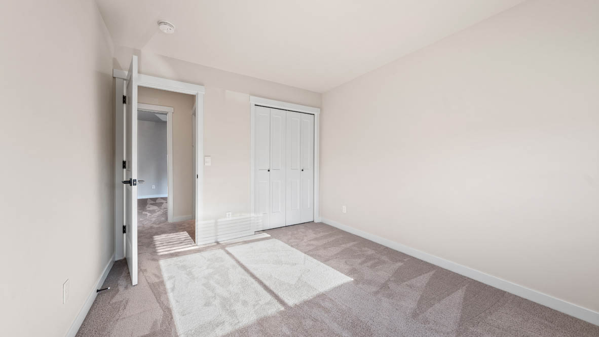 Stevens Ranch bedroom with closet and carpet
