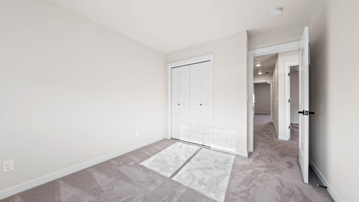 Stevens Ranch bedroom with closet and carpet