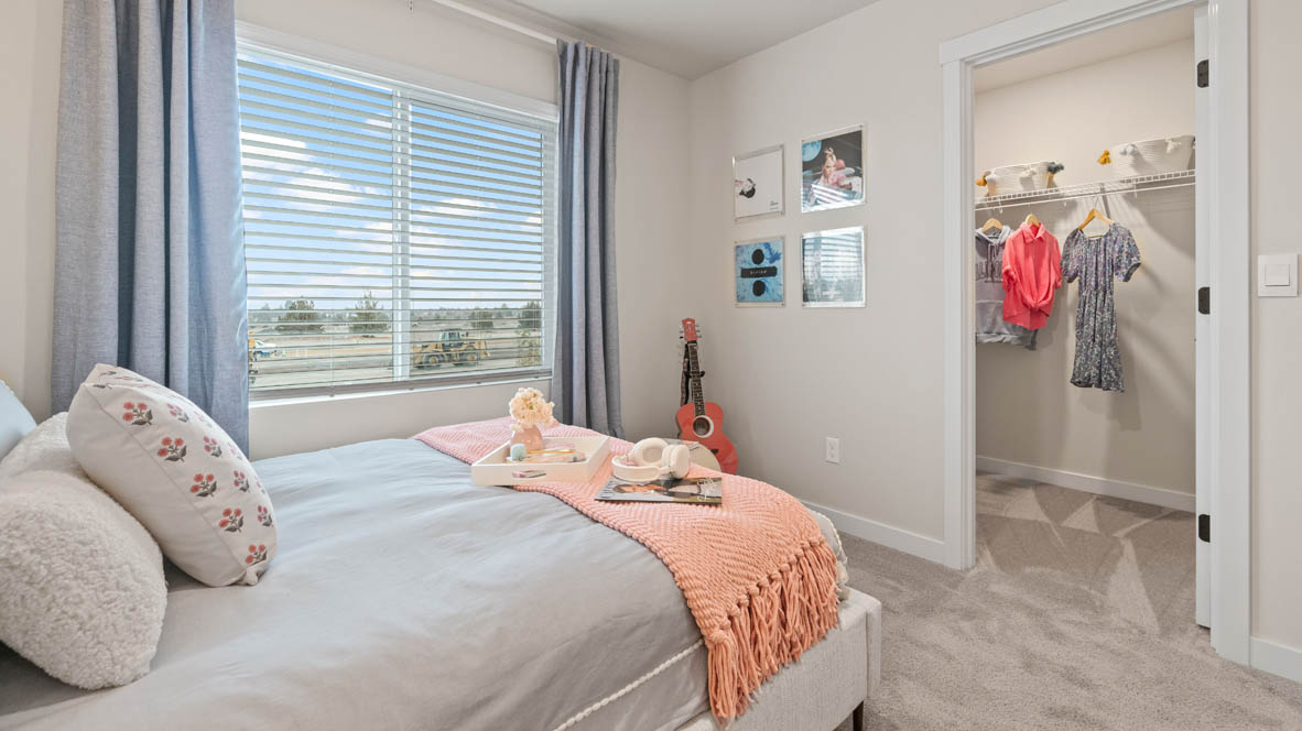 Stevens Ranch Bedroom with heart and music theme, a pink and blue bed, a pink guitar and pink drapes and a walk in closet