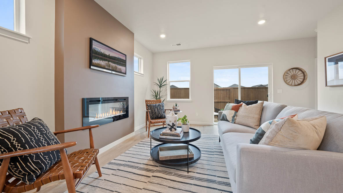 Stevens Ranch great room with white couch, rocking chair, rug, coffee table