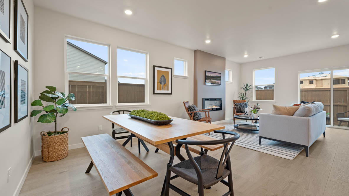 Stevens Ranch dining room with dining table, plants, windows, and view of great room