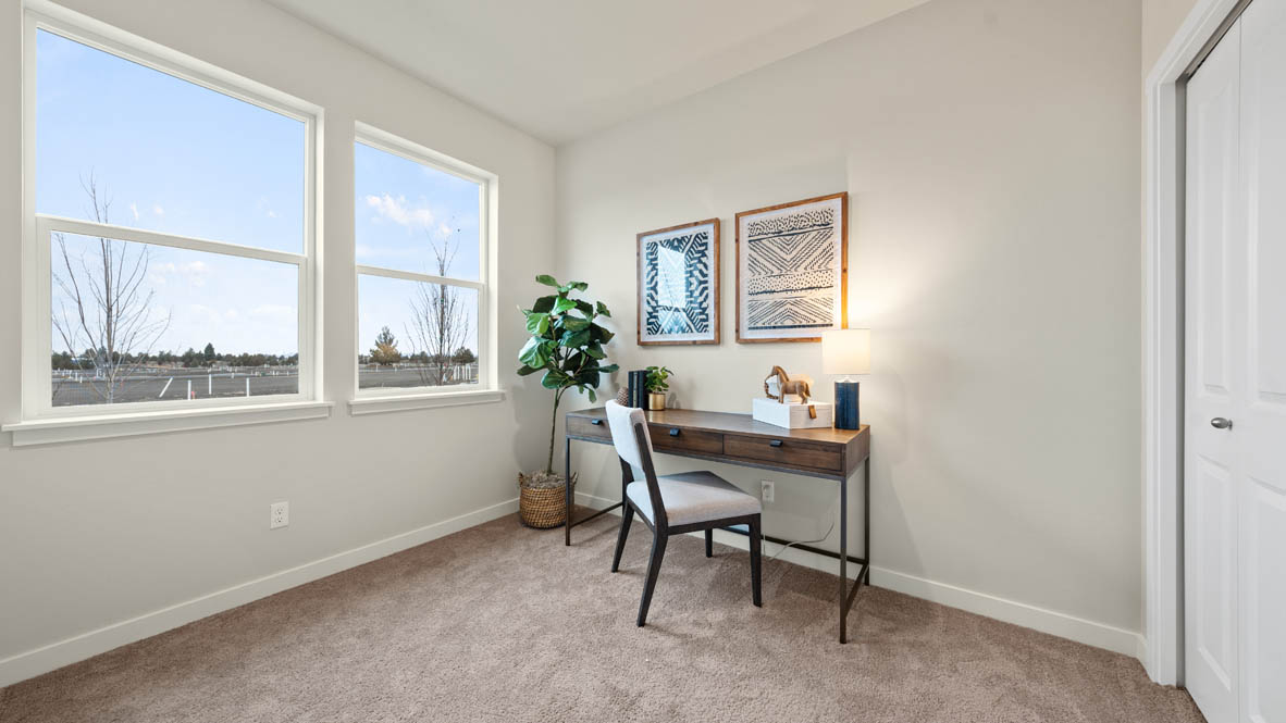 Stevens Ranch office with carpet, windows, working desk, and closet