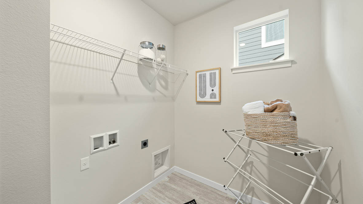 Stevens Ranch laundry room with white white wire shelving