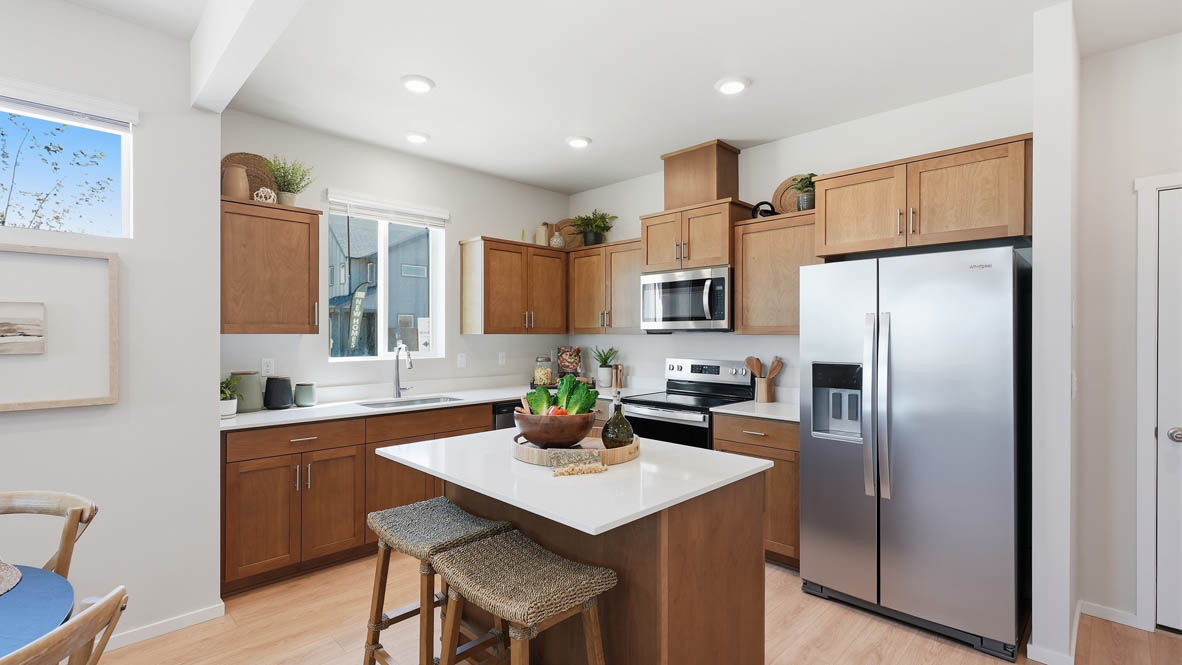 Stevens Ranch kitchen with stained cabinets and stainless steel appliances