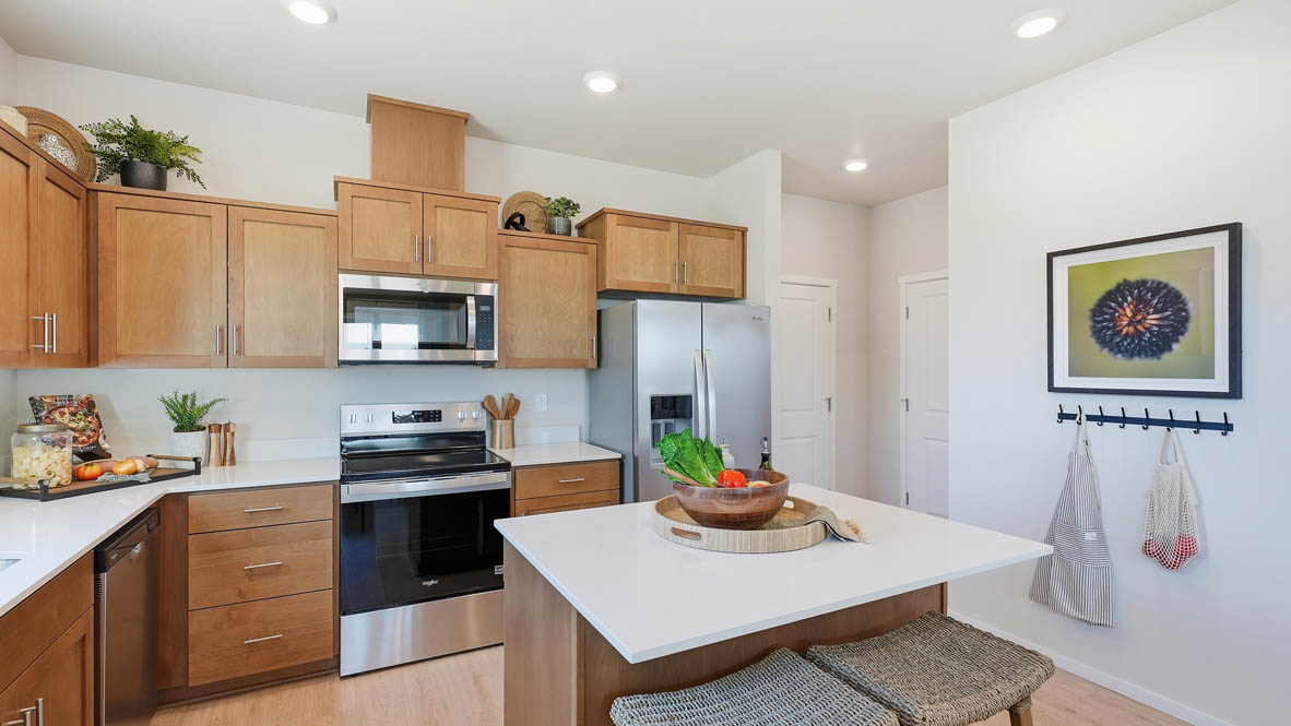Stevens Ranch kitchen with stained cabinets and stainless steel appliances