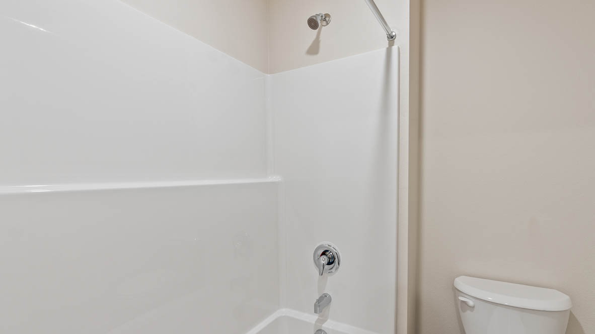 Monrovia Bathroom with single sink vanity, quartz countertops, toilet, ad shower tub