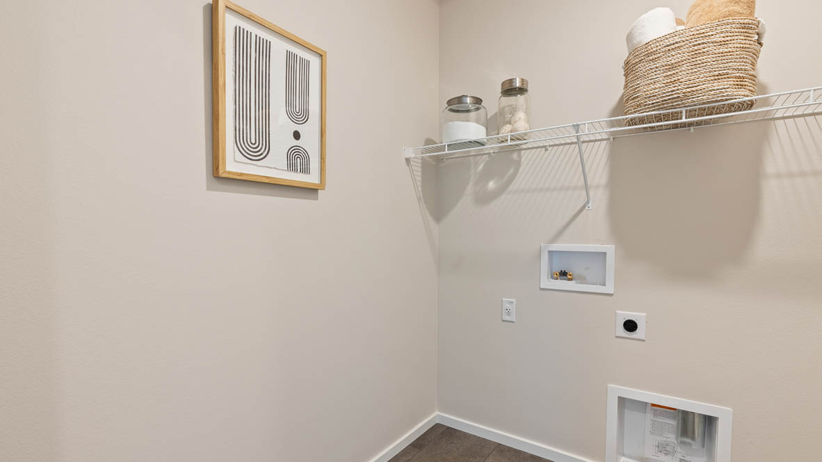 Monrovia laundry room with white wire shelving