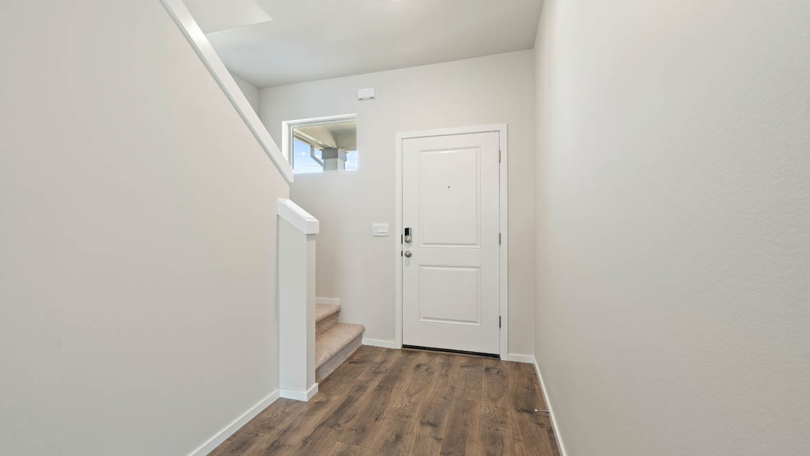 Monrovia entry with stairs, door, window, laminate flooring