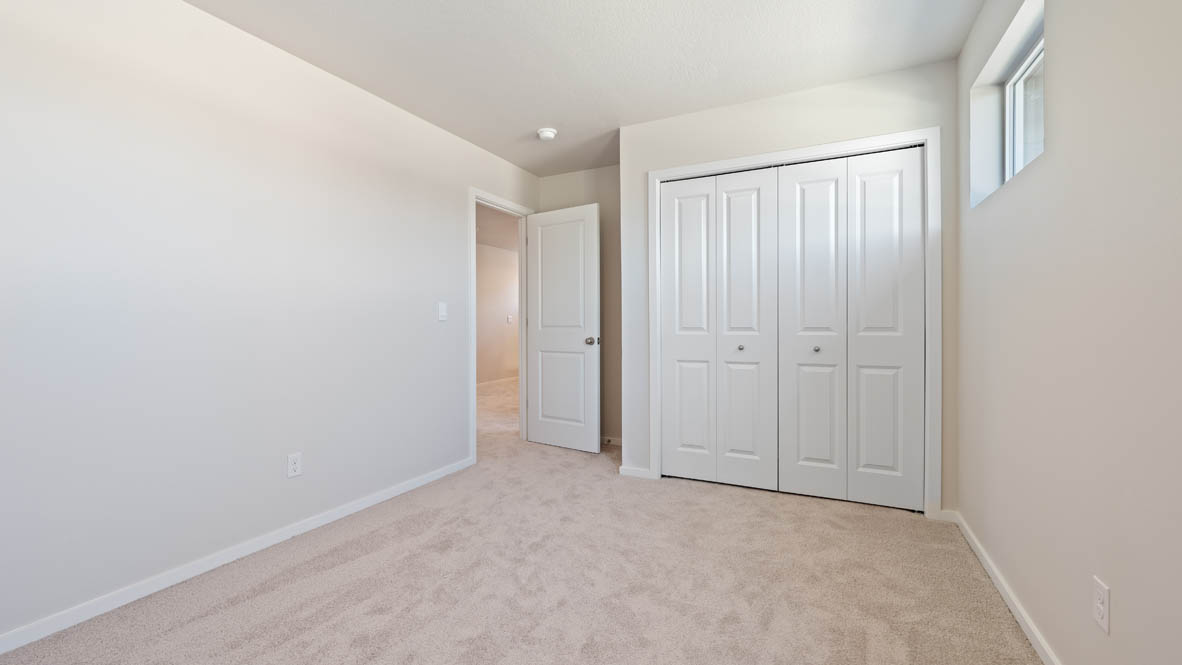 Monrovia bedroom with closet, windows, carpet, and white walls