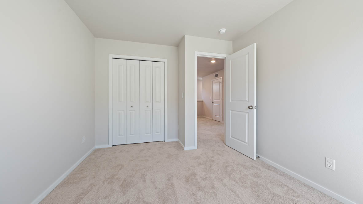 Monrovia bedroom with closet, windows, carpet, and white walls