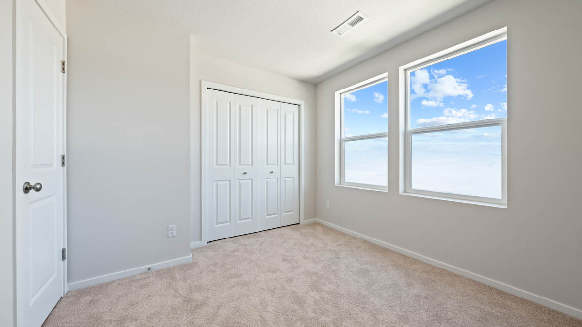 Monrovia bedroom with closet, windows, carpet, and white walls
