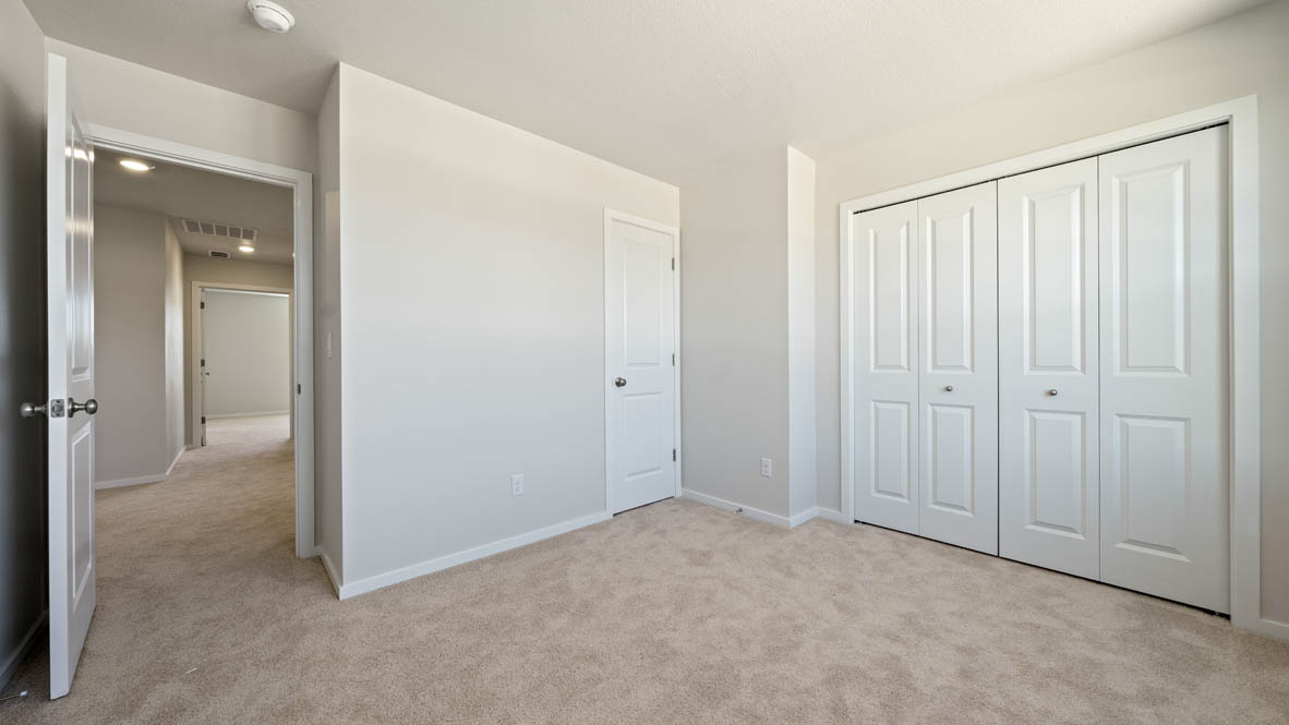 Monrovia bedroom with closet, windows, carpet, and white walls
