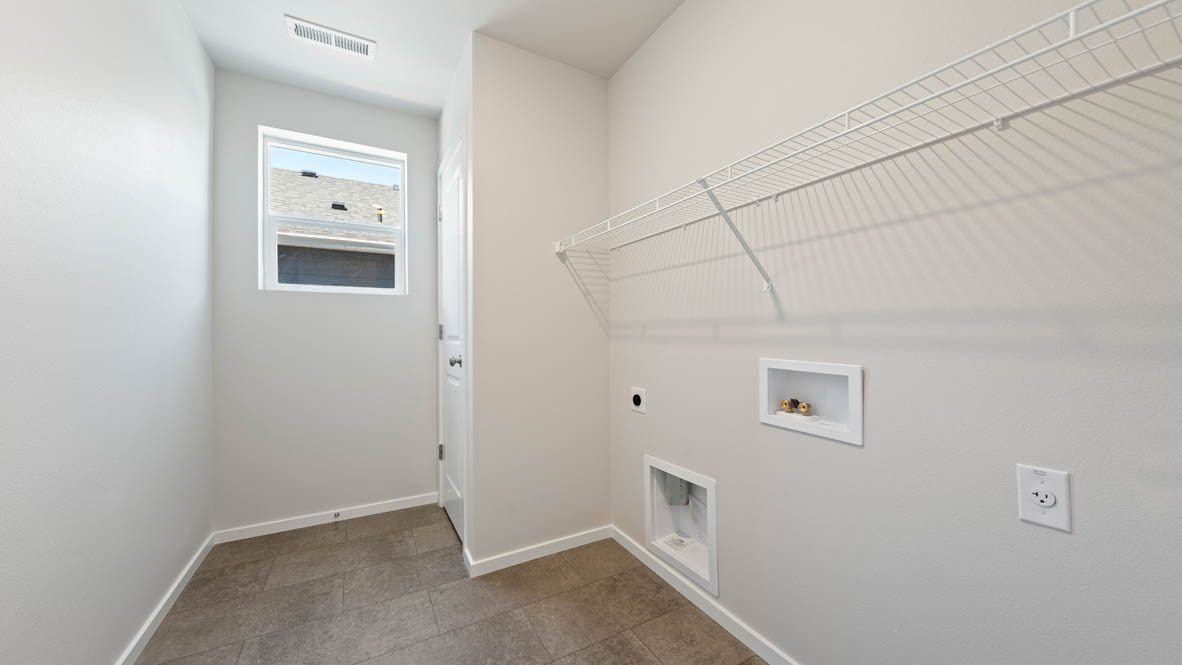 Monrovia laundry room with white wire shelving