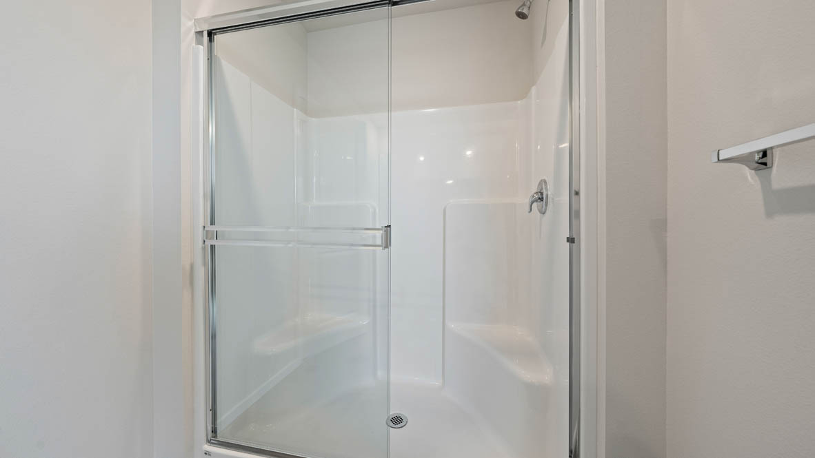 Monrovia primary bathroom with sliding glass shower