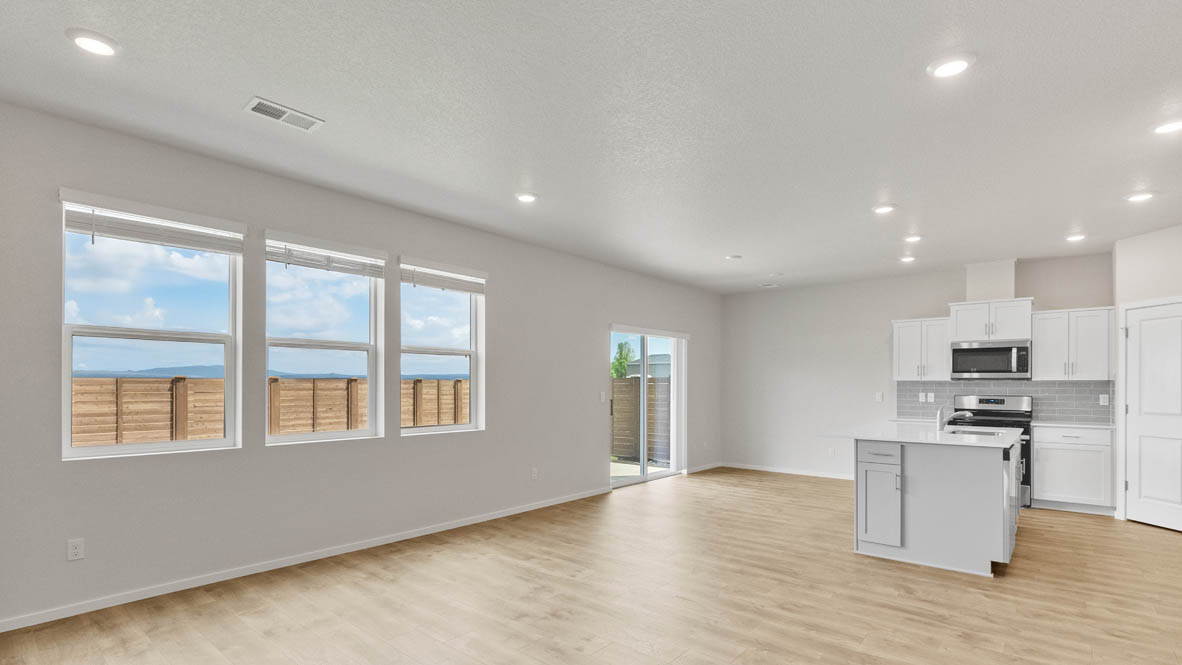 Monrovia Dining and Kitchen  with laminate flooring, electric fireplace, and windows