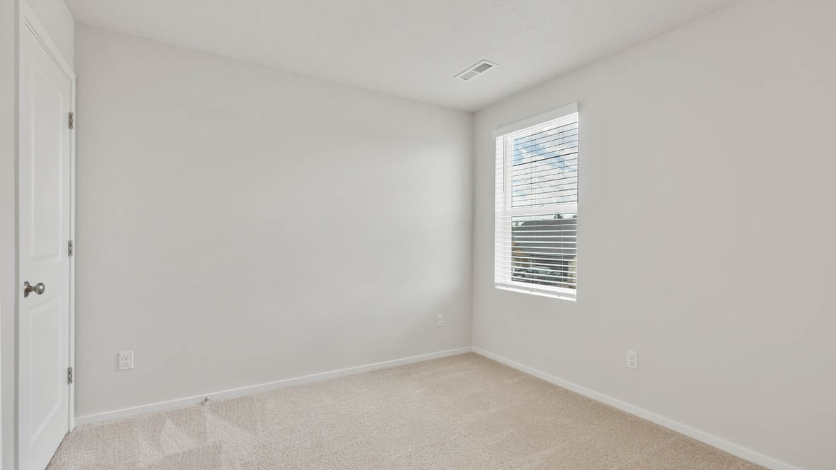 Monrovia bedroom with window, carpet, and walls