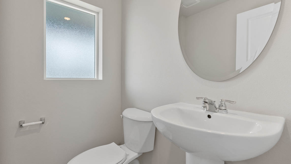 Monrovia powder room with window and sink, toilet