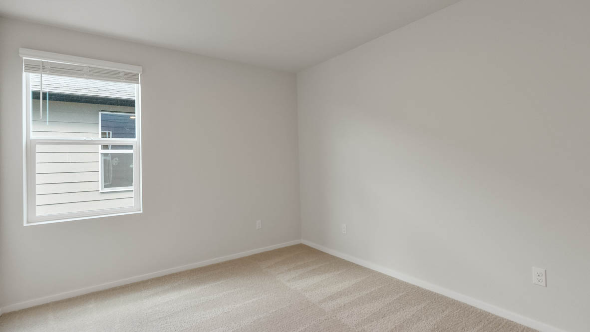 Monrovia bedroom with window, carpet, and walls