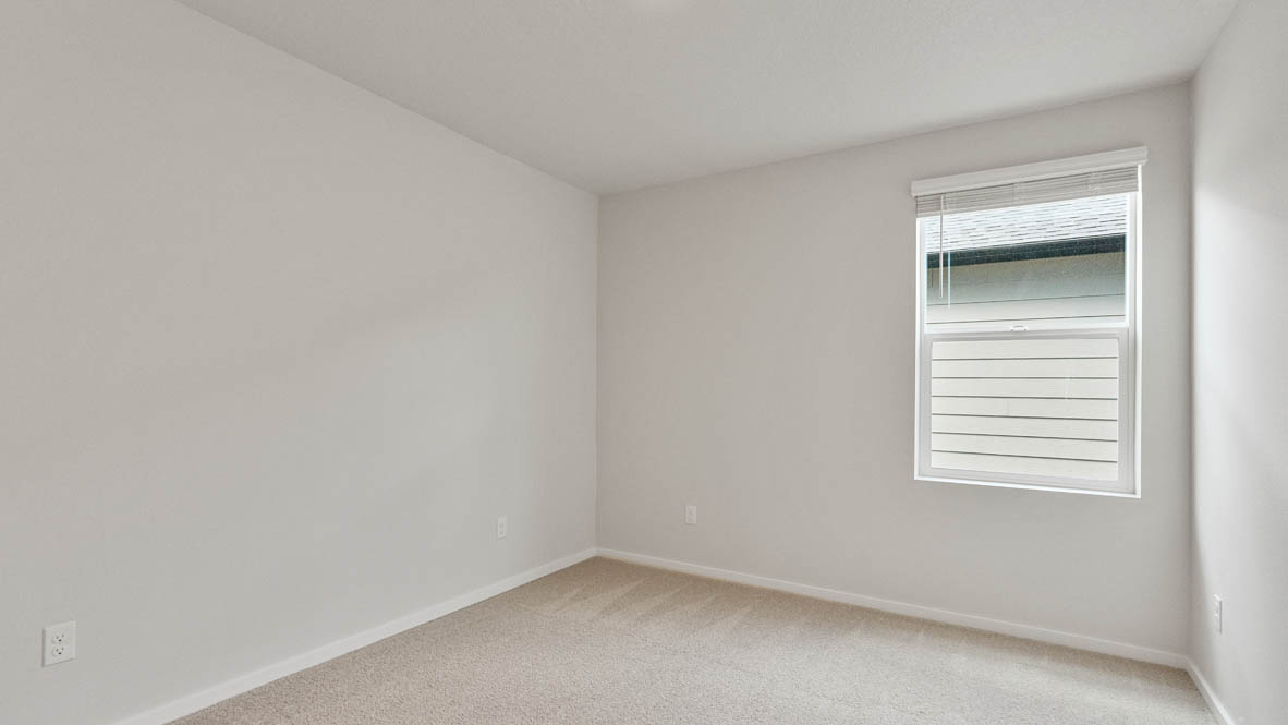 Monrovia bedroom with window, carpet, and walls