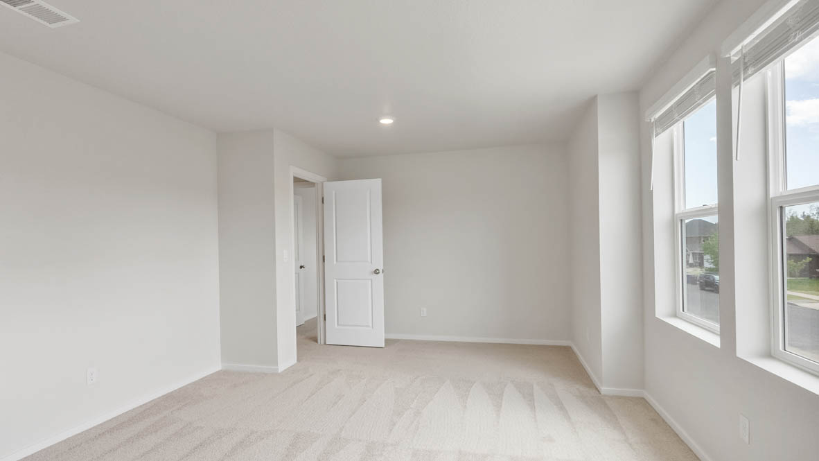 Monrovia bonus room with carpet, windows, and walls