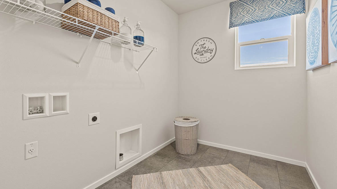 Monrovia Laundry Room with a hamper, laminate flooring, and white wire shelving