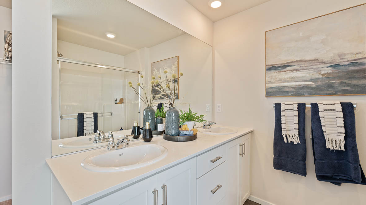 Monrovia Primary bathroom with walk in shower with glass doors and tub