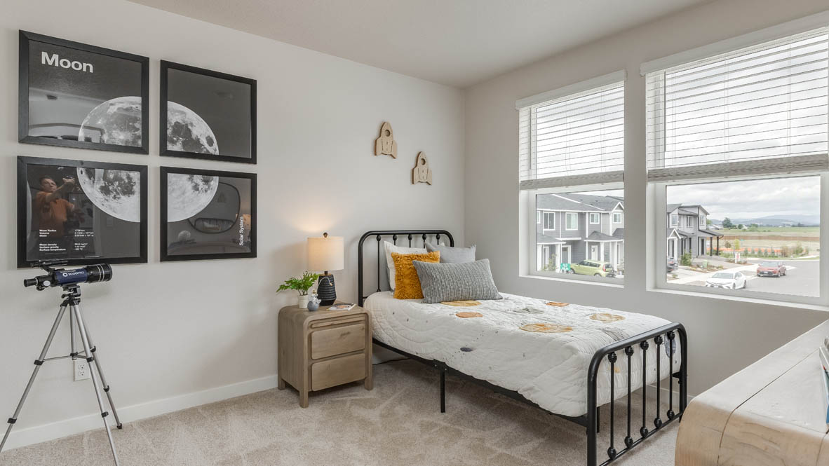 Davis Estates bedroom with carpet, windows, four paintings of the moon, telescope, and a dresser