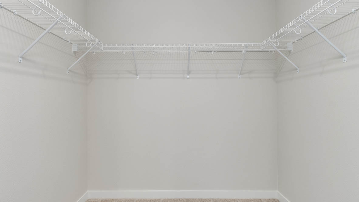 Davis Estates walk in closet with white wire shelving