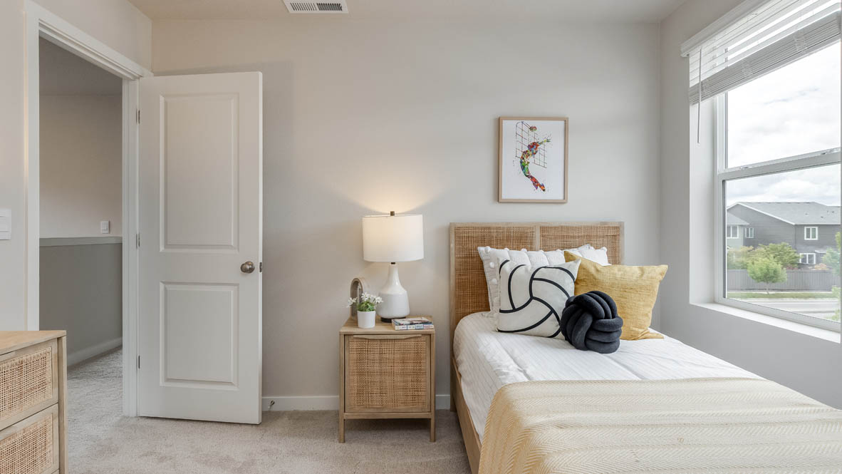 Davis Estates bedroom with a bed, nightstand, dresser, and window