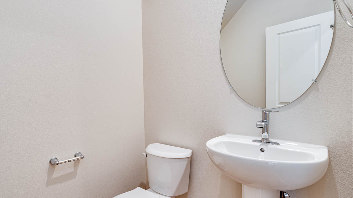 Davis Estates powder room with pedestal sink and toilet