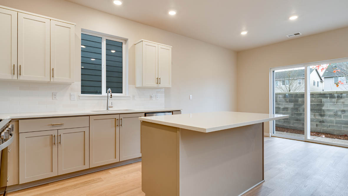 Davis Estates kitchen with shaker style cabinets and white quartz countertops