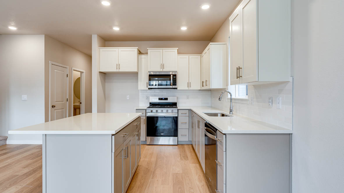Davis Estates kitchen with shaker style cabinets and white quartz countertops