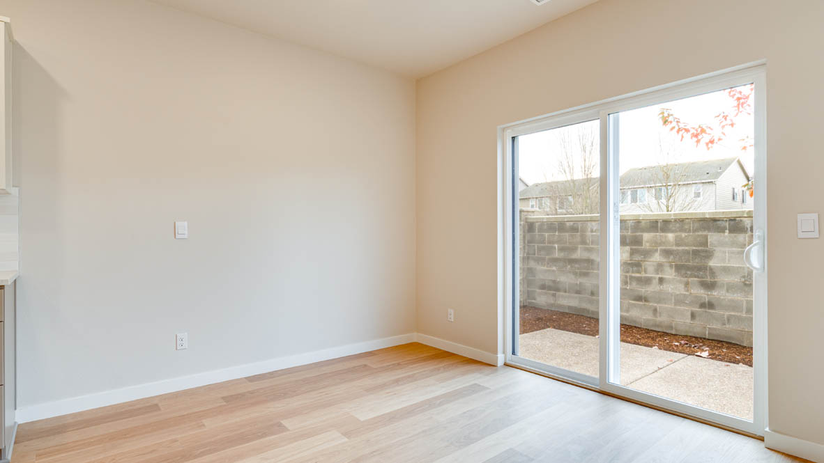 Davis Estates dining room with sliding glass door to exterior