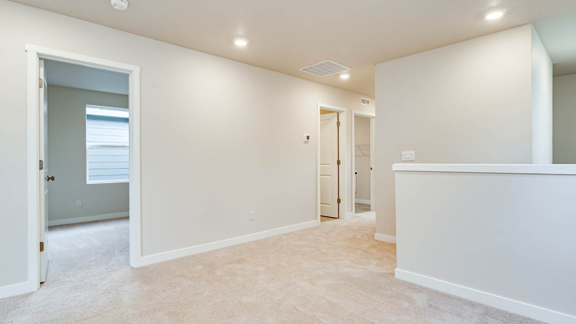 Davis Estates upstairs loft with carpeting
