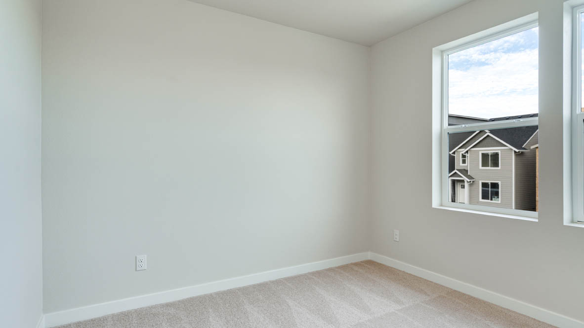 Davis Estates bedroom with carpeting and white walls and windows