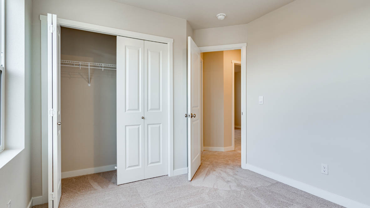 Davis Estates bedroom with carpeting and white walls and windows