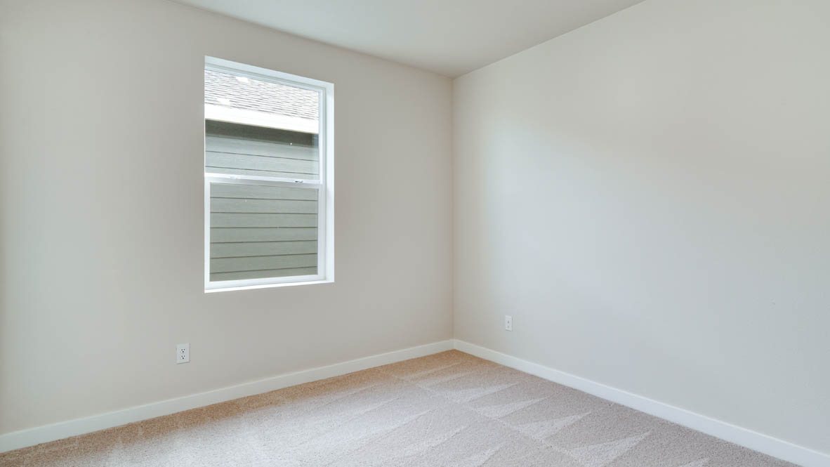Davis Estates bedroom with carpeting and white walls and windows