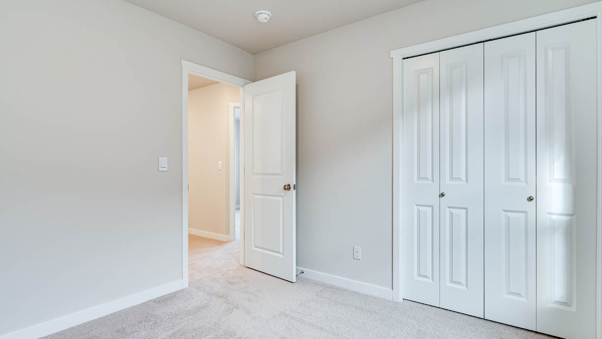 Davis Estates bedroom with carpeting and white walls and windows
