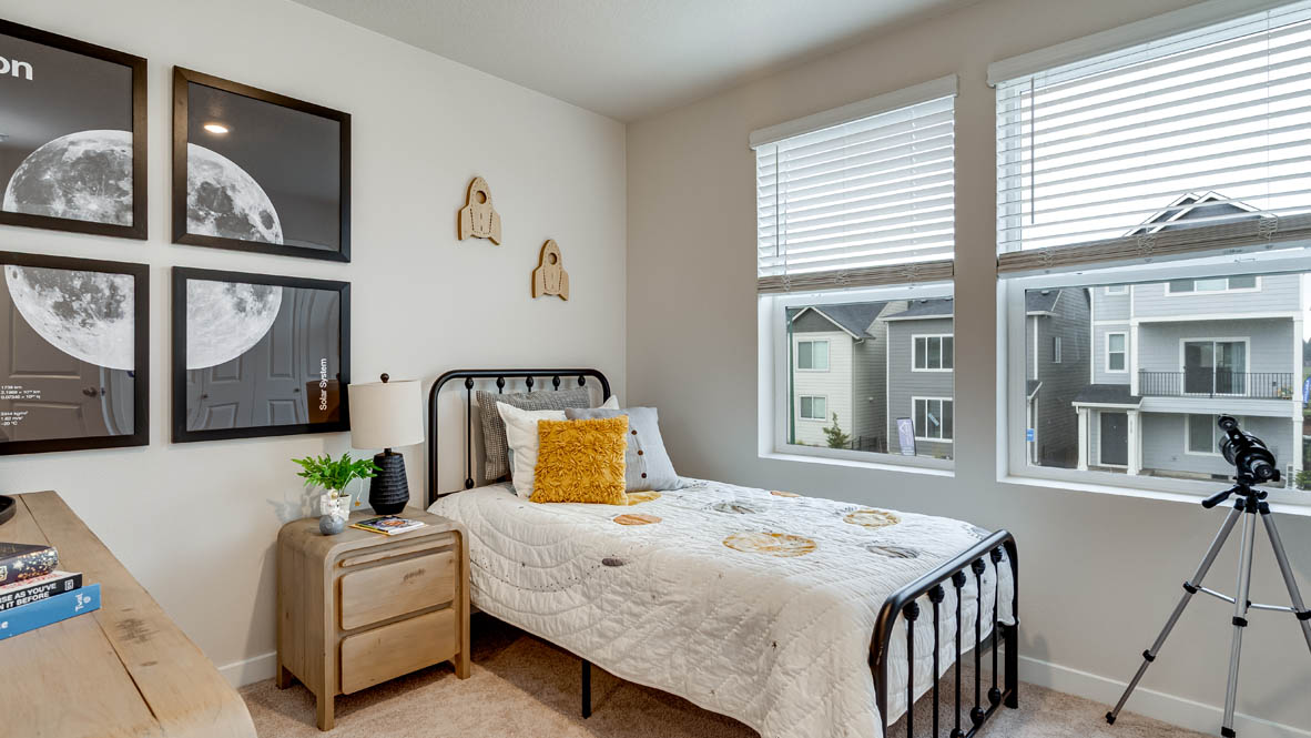 Davis Estates bedroom with a bed, nightstand, dresser, and window