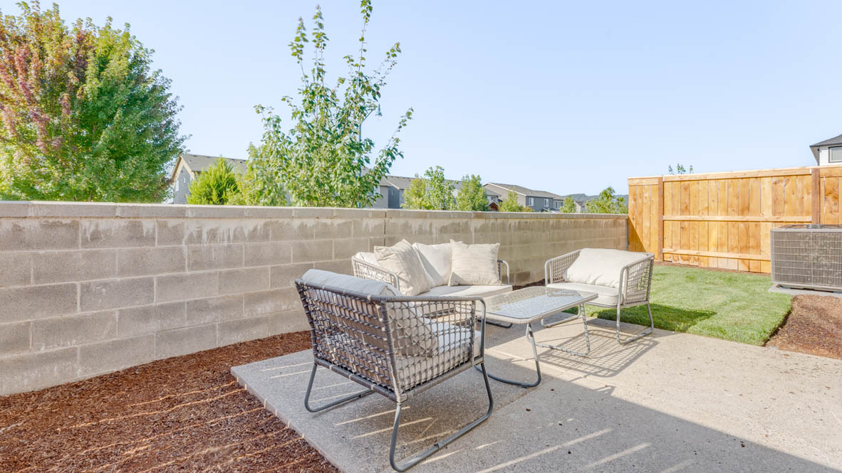 Davis Estates yard with chairs, and grass