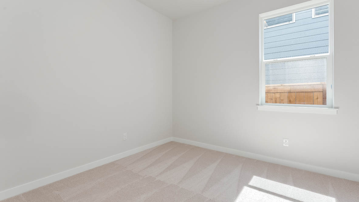 Davis Estates bedroom with carpet, window, and white walls